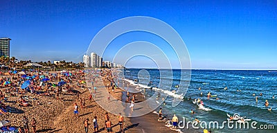 Crowded sands of Deerfield Beach near the pier with unrecognizable faces Editorial Stock Photo