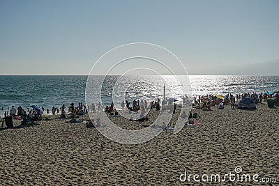 Crowded Santa Monica beach with tourist and families enjoying the summer Editorial Stock Photo