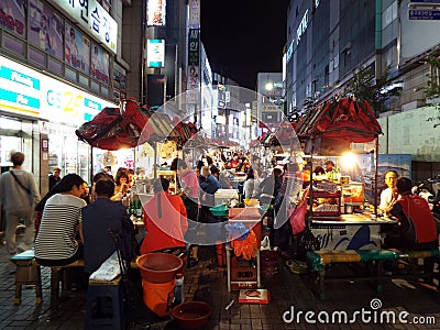 Crowded street at Jagalchi market restaurants in Busan Editorial Stock Photo