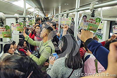 Crowded subway train carriage, Shanghai China Editorial Stock Photo