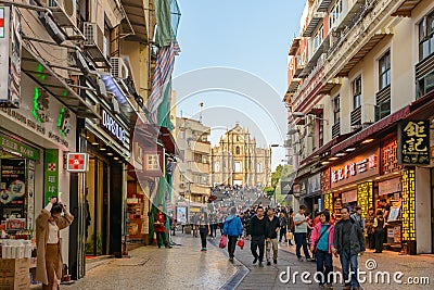 A crowded tourist square in front of Ruins of Saint Paul`s Church Editorial Stock Photo