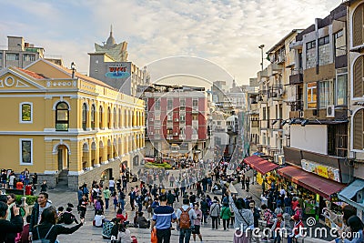 A crowded tourist square in front of Ruins of Saint Paul`s Church Editorial Stock Photo