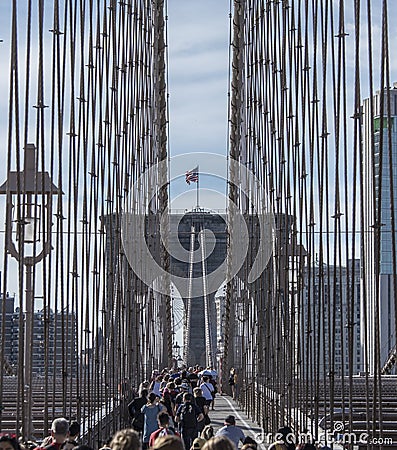 Crowds crossing the pedestrian walkway on the Brooklyn Bridge in New York City Editorial Stock Photo