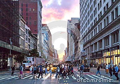 Crowds of diverse people cross the busy intersection on 23rd Street and 5th Avenue in Manhattan New York City Editorial Stock Photo