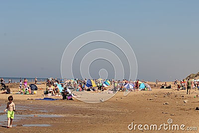 Crowds of people flock to Formby Beach, Liverpool during the current summer heatwave. Editorial Stock Photo