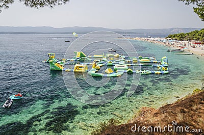 Crowds of people on Golden Cape beach. Golden Cape is the most famous beach in Croatia located on Brac island. Editorial Stock Photo