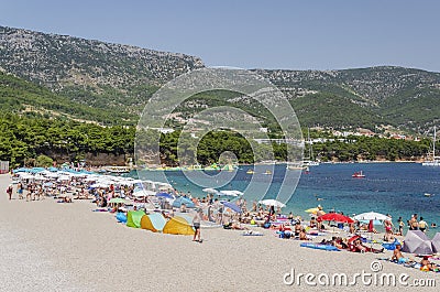 Crowds of people on Golden Cape beach. Golden Cape is the most famous beach in Croatia located on Brac island. Editorial Stock Photo