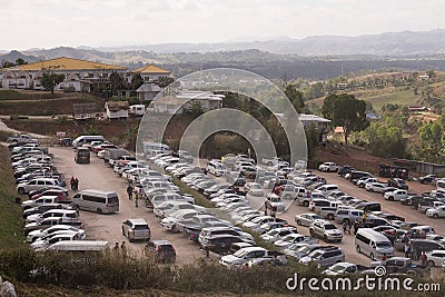 Crowed of cars parked at parking lot to visit tourist place on the mountain Editorial Stock Photo