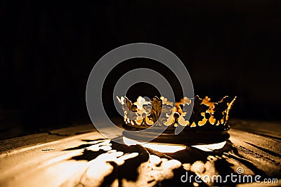 Crown of the real king on a black background. Battle for the Throne Stock Photo