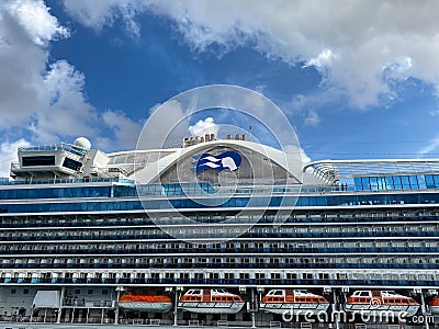 The Crown Princess cruise ship, is owned by Carnival Corporation, docked at Aruba on a sunny day with blue skies Editorial Stock Photo