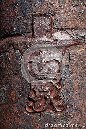 Crown and Royal cypher on old cannon in the Caribbean Stock Photo