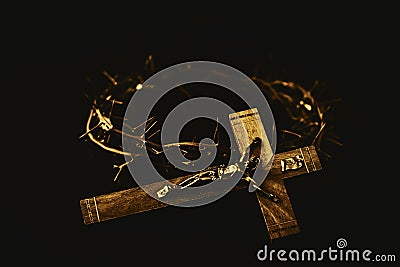 the crown of thorns and the crucifix of Jesus on back background against window light with copy space Stock Photo