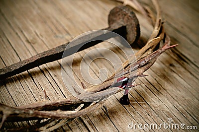 The crown of thorns of Jesus Christ and a nail on the Holy Cross Stock Photo