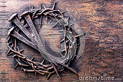 Crown of thorns and nails engraved on stone Stock Photo