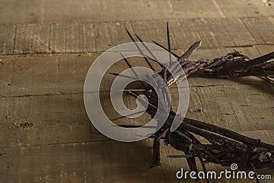 Crown of thorns on wooden background with copy space. Easter religious motive commemorating the resurrection of Jesus Stock Photo