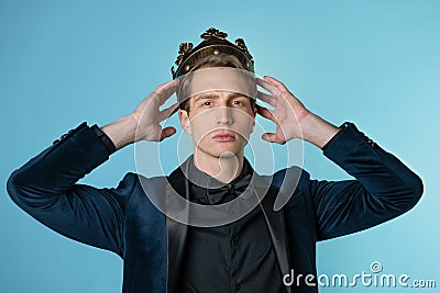 Crown yourself, a successful young businessman with a crown over head. Stock Photo