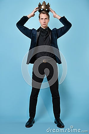 Crown yourself, a successful young businessman with a crown over head. Stock Photo