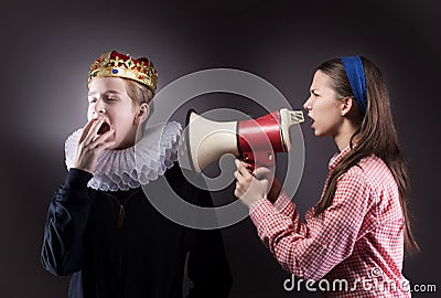 Crowned boy ignores the girl. Stock Photo