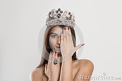 Crowned dark beauty queen. Brunette woman fashion model Stock Photo