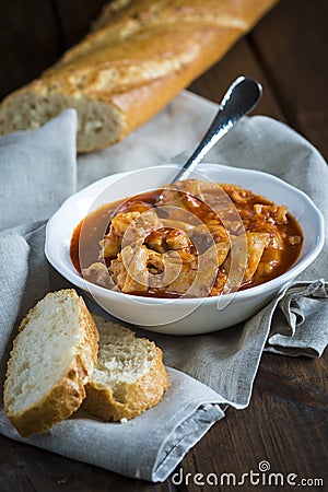 Crubeens with tomato sauce and bread Stock Photo
