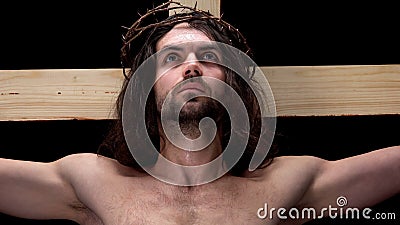 Crucified son of God looking up, religious self-sacrifice, bible history, belief Stock Photo