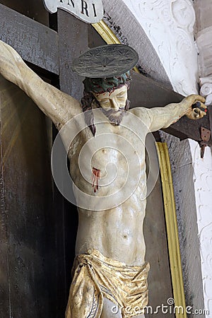 Crucifix, altar of the Holy Cross in the Saint Martin Church in Zrnovo, Croatia Editorial Stock Photo