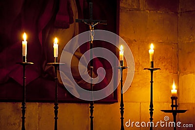 Crucifix and candles Stock Photo