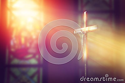 Crucifix, jesus on the cross in church with ray of light. Stock Photo