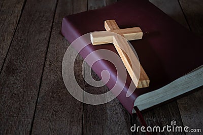 The crucifix lay on the bible. It is a blessing from God with the power and power of holiness, which brings luck and shows Stock Photo