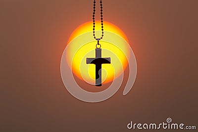 The crucifix in the middle of the rising sun or the setting sun, the concept of Christianity, the blessing of praying to Jesus Stock Photo