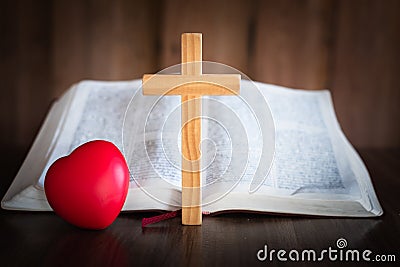 The crucifix is placed in the middle of the Bible. The idea of asking blessings from God with the power and power of holiness, Stock Photo