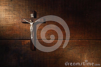 Crucifix On Wooded Wall Stock Photo