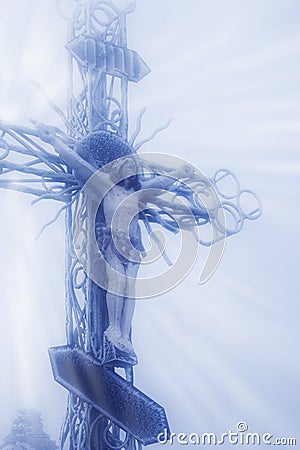 The crucifixion of Jesus Christ statue in snow and fog Stock Photo