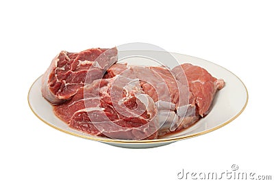 Crude meat on a plate Stock Photo