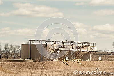 Crude oil tanks for storage to be unloaded into trucks Stock Photo