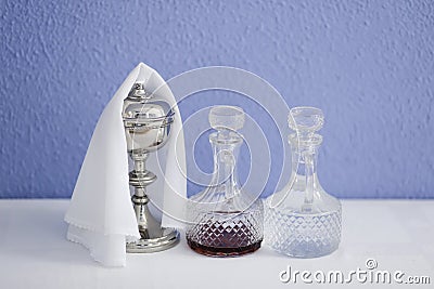 cruets with water and wine and chalice Stock Photo