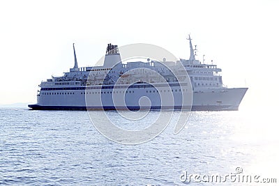 Cruise boat offshore sea reflection backlight Stock Photo