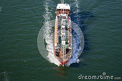 Cruise boat with people top view. Touristic ship on river Douro. Summer voyage. Cruise journey. Stock Photo