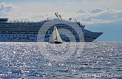 Cruise liner and a small yacht Stock Photo