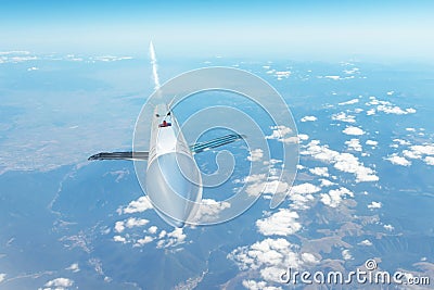 Cruise missile flying in the sky leaving a smoky trail Stock Photo