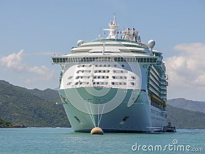 Cruise Ship Anchored With Small Boat Stock Photo