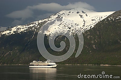 Cruise ship crusing Fjord in Alaska Inside Passage Stock Photo