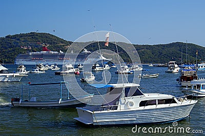 Cruise Ship & Fishing Boats Stock Photo