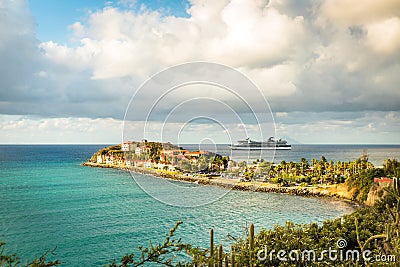 Cruise ship on the horizon with tropical resort of Sint Maarten Editorial Stock Photo