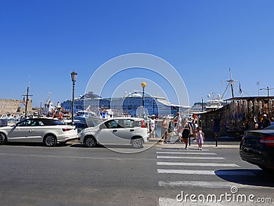 Cruise ship in the large Harbour by the old walled Town of Rhodes in the Greek Islands Editorial Stock Photo