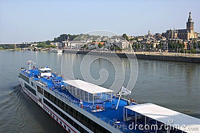 Cruise ship passing skyline city Nijmegen Editorial Stock Photo