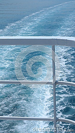 Cruise Ship Railings and Ocean Wake Stock Photo