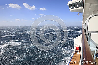 Cruise ship view from a balcony of rough seas and blue sky Stock Photo