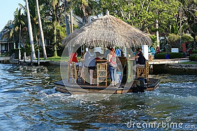 Cruising and boozing tiki bar going down the New River in Fort Lauderdale. Editorial Stock Photo
