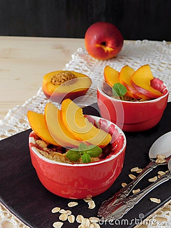 Crumble dessert decorated with fresh nectarines Stock Photo